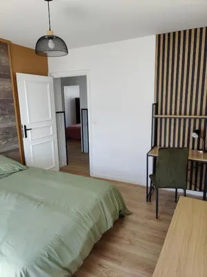 Un ou plusieurs lits dans un hébergement de l'établissement T4 coeur de ville, à deux pas de la plage - 3 chambres