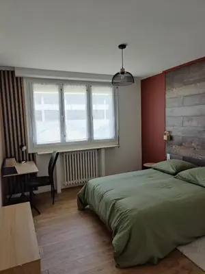 Un ou plusieurs lits dans un hébergement de l'établissement T4 coeur de ville, à deux pas de la plage - 3 chambres