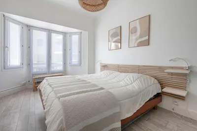 Un ou plusieurs lits dans un hébergement de l'établissement Appart-patio Centre-ville à 100m de la plage