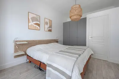 Un ou plusieurs lits dans un hébergement de l'établissement Appart-patio Centre-ville à 100m de la plage