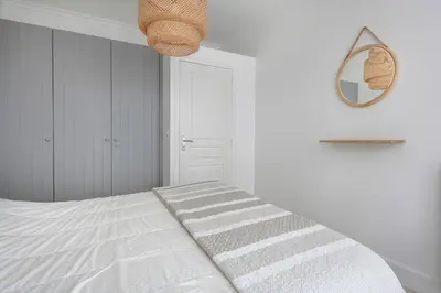 Un ou plusieurs lits dans un hébergement de l'établissement Appart-patio Centre-ville à 100m de la plage