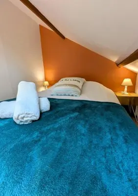 Un ou plusieurs lits dans un hébergement de l'établissement Maison cozy plage & jardin
