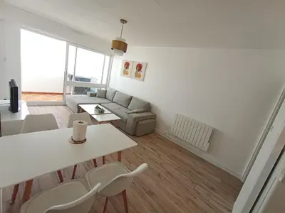 Coin salon dans l'établissement Appartement T2 vue mer, pieds dans l'eau