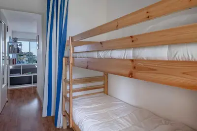 Un ou plusieurs lits dans un hébergement de l'établissement Face Mer, appartement pour 4 personnes