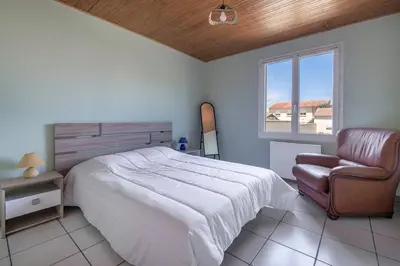 Un ou plusieurs lits dans un hébergement de l'établissement Maison pour 6 avec jardin à La Plaine sur Mer
