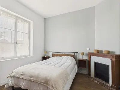 Un ou plusieurs lits dans un hébergement de l'établissement Maison pour 6 avec jardin proche du centre