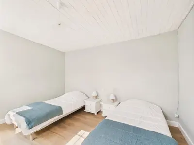 Un ou plusieurs lits dans un hébergement de l'établissement Maison pour 6 avec jardin proche du centre