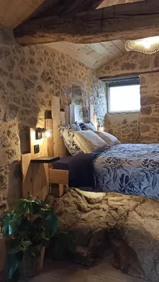 Un ou plusieurs lits dans un hébergement de l'établissement Gîte La Loge Ligeron