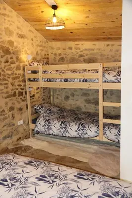 Un ou plusieurs lits dans un hébergement de l'établissement Gîte La Loge Ligeron