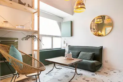 Coin salon dans l'établissement L'Ogive - Charmant appartement au coeur de Clisson