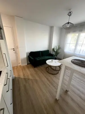 Coin salon dans l'établissement Appartement proche plage et centre-ville