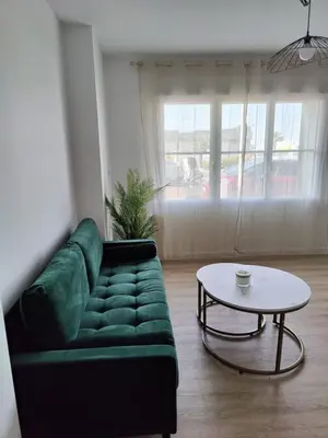 Coin salon dans l'établissement Appartement proche plage et centre-ville