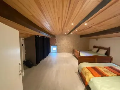 Un ou plusieurs lits dans un hébergement de l'établissement Maison charme à Mauléon avec jardin privé