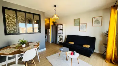 Coin salon dans l'établissement Appartement bord de mer