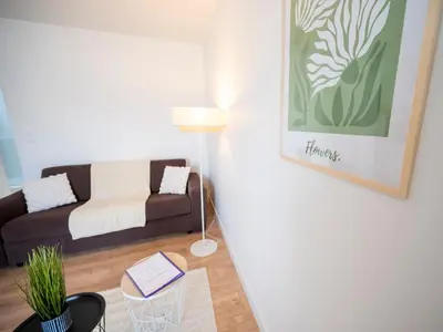 Coin salon dans l'établissement Le Regard sur La Place Léger et Raffiné