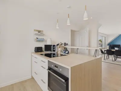 Cuisine ou kitchenette dans l'établissement 180m de la plage appartement 4 adultes - 4 enfants
