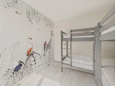Un ou plusieurs lits dans un hébergement de l'établissement 180m de la plage appartement 4 adultes - 4 enfants