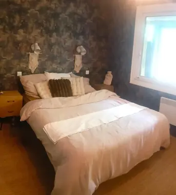 Un ou plusieurs lits dans un hébergement de l'établissement Maison au calme en bord de mer
