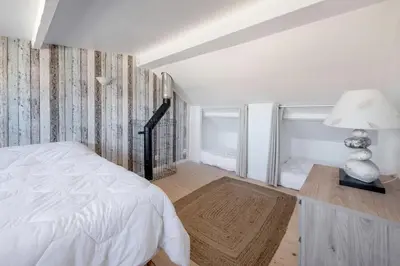 Un ou plusieurs lits dans un hébergement de l'établissement Maison à 50m de la mer, 4 adultes et 2 enfants
