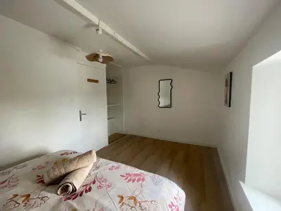 Un ou plusieurs lits dans un hébergement de l'établissement Maison 3 chambres 4 minutes du Puy