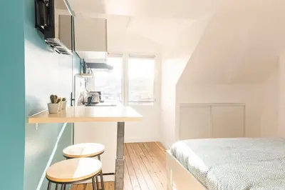 Un ou plusieurs lits dans un hébergement de l'établissement Studio Bel Ami - Nantes centre ville