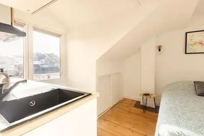 Un ou plusieurs lits dans un hébergement de l'établissement Studio Bel Ami - Nantes centre ville