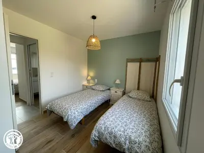 Un ou plusieurs lits dans un hébergement de l'établissement Charmant gîte avec terrasse à La Barre-de-Monts - FR-1-426-586