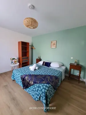 Un ou plusieurs lits dans un hébergement de l'établissement Maison du Puy avec jardin clos, 4 min Puy duFou