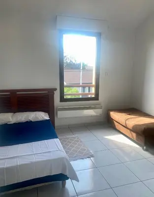 Un ou plusieurs lits dans un hébergement de l'établissement super appartement