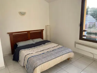 Un ou plusieurs lits dans un hébergement de l'établissement super appartement