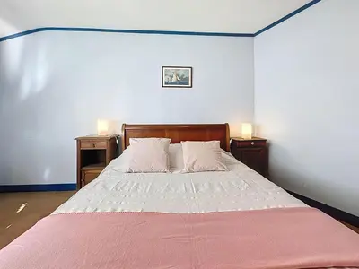 Un ou plusieurs lits dans un hébergement de l'établissement Holiday Home Les Volets Bleus by Interhome
