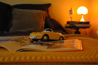 Un ou plusieurs lits dans un hébergement de l'établissement Cottage du collectionneur