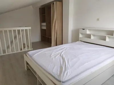 Un ou plusieurs lits dans un hébergement de l'établissement Location maison proche golf