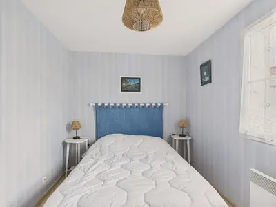 Un ou plusieurs lits dans un hébergement de l'établissement Jardin et véranda - Maison 4 adultes 2 enfants