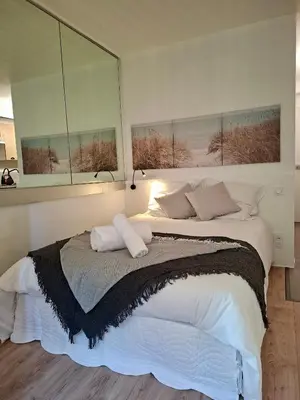 Un ou plusieurs lits dans un hébergement de l'établissement Appartement neuf proche Nantes avec parking