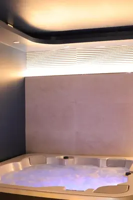 Un ou plusieurs lits dans un hébergement de l'établissement Li li et rose - Suite avec jacuzzi privatif