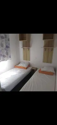 Un ou plusieurs lits dans un hébergement de l'établissement Mobil-home 3 chambres 6 personnes