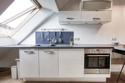 Cuisine ou kitchenette dans l'établissement Là-Haut - Wifi - Centre-ville