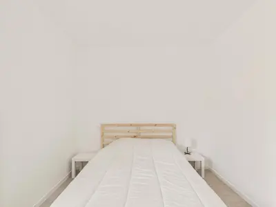 Un ou plusieurs lits dans un hébergement de l'établissement Appartement pour 4 à St-Jean-de-Mont - Jardin