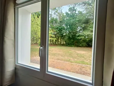 Jardin de l'établissement T1 cosy avec jardin à 7 min de l'aéroport, proche de Nantes