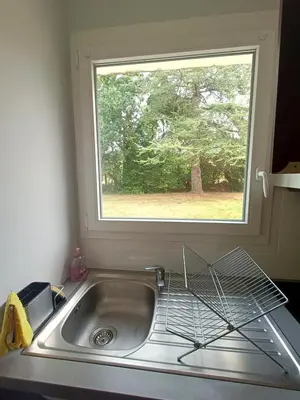 Cuisine ou kitchenette dans l'établissement T1 cosy avec jardin à 7 min de l'aéroport, proche de Nantes