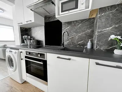 Cuisine ou kitchenette dans l'établissement Vivez au cœur de Saint-Nazaire ! Ville & Plages