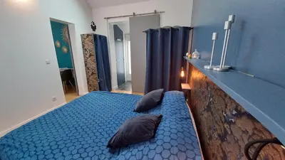 Un ou plusieurs lits dans un hébergement de l'établissement Les Appartements du 104