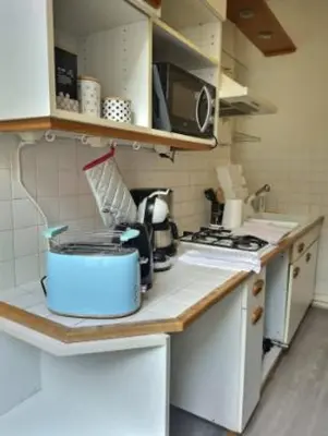 Cuisine ou kitchenette dans l'établissement Place du Temps, appartement de caractère plein centre