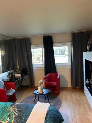 Coin salon dans l'établissement Les temps Heureux