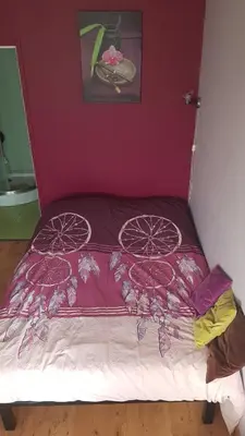 Un ou plusieurs lits dans un hébergement de l'établissement Chambre cosy