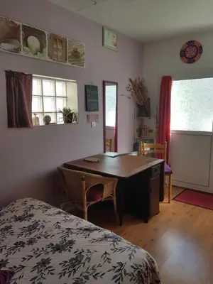 Un ou plusieurs lits dans un hébergement de l'établissement Chambre cosy