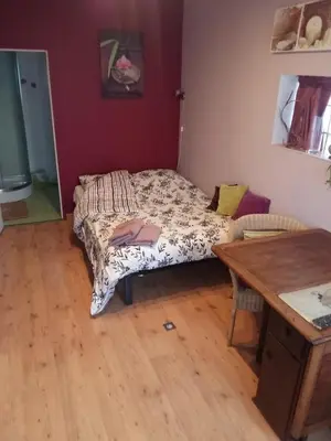 Un ou plusieurs lits dans un hébergement de l'établissement Chambre cosy
