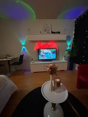 Télévision ou salle de divertissement dans l'établissement Évasion Nuageuse