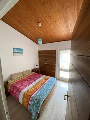 Un ou plusieurs lits dans un hébergement de l'établissement Maison 200m plage rue pietonne